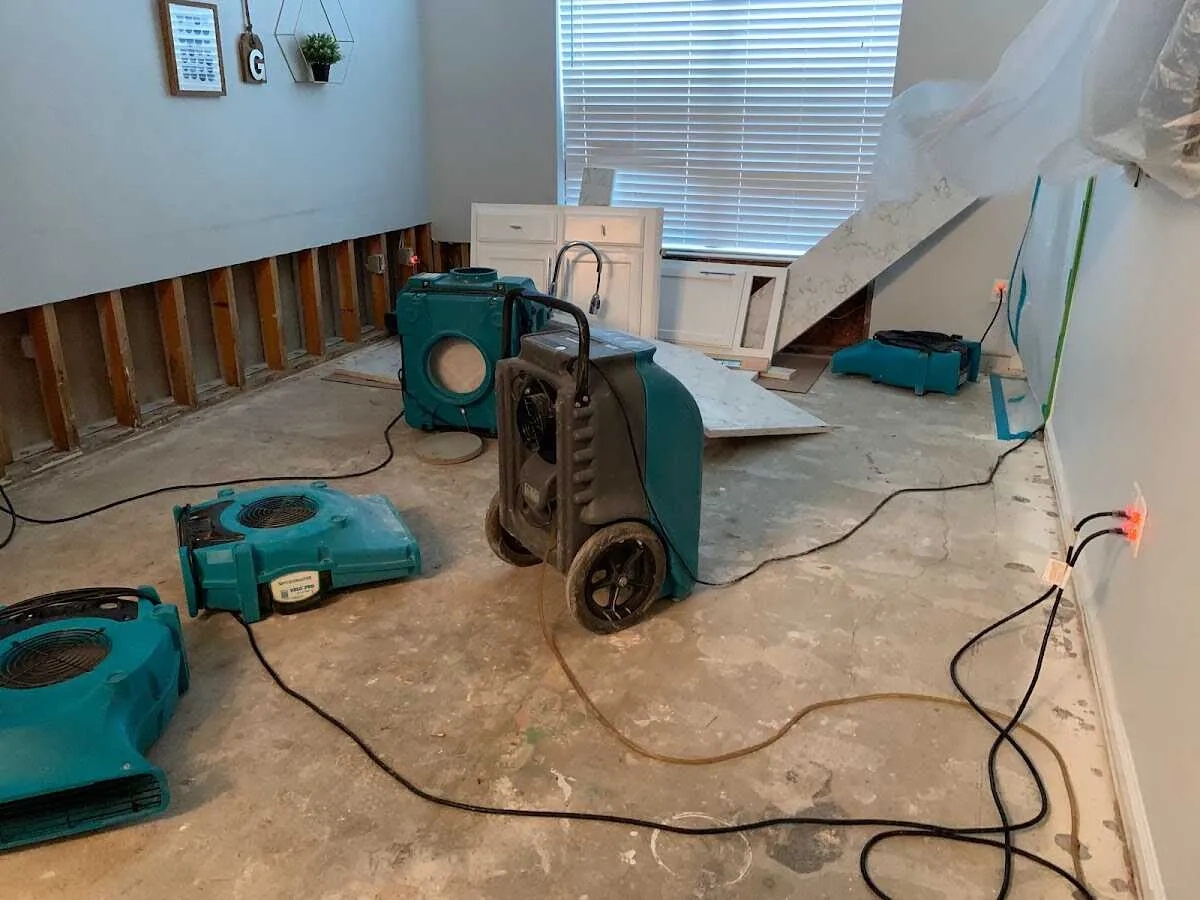 Dehumidifier in flood-cut room for Water Damage Restoration in Norton